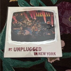 NIRVANA Unplugged in New York Album Cover with Red and Black